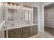 Double vanity bathroom with grey cabinets and quartz countertops at 38805 Ranch Gate Blvd, Umatilla, FL 32784