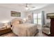 Cozy bedroom with a queen-size bed and plenty of natural light at 39509 Harbor Hills Blvd, Lady Lake, FL 32159