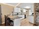 Modern kitchen with white cabinets and granite countertops at 4516 Eagles Nest Rd, Fruitland Park, FL 34731