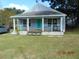 Charming single story house with teal door and green lawn at 507 Barwick St, Wildwood, FL 34785