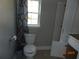 Simple bathroom with toilet and shower at 507 Barwick St, Wildwood, FL 34785