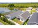 Houses near a pond, showcasing a community setting at 5238 Dalessandro Rd, The Villages, FL 32163