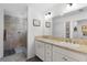 Elegant bathroom with double vanity and large mirror at 5238 Dalessandro Rd, The Villages, FL 32163