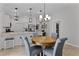 Bright dining area with a round wooden table and gray chairs at 5238 Dalessandro Rd, The Villages, FL 32163