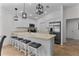 Modern kitchen with stainless steel appliances and an island with seating at 5238 Dalessandro Rd, The Villages, FL 32163