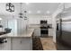 Modern kitchen with stainless steel appliances and island at 5238 Dalessandro Rd, The Villages, FL 32163
