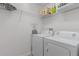 Laundry room with washer, dryer, and shelving at 5238 Dalessandro Rd, The Villages, FL 32163