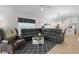 Living room featuring a sectional sofa, and views to kitchen and backyard at 5238 Dalessandro Rd, The Villages, FL 32163