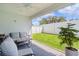 Relaxing screened patio with seating area and potted plants at 5238 Dalessandro Rd, The Villages, FL 32163