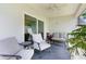 Comfortable screened patio with seating area and plants at 5238 Dalessandro Rd, The Villages, FL 32163