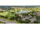 Aerial view of community with golf course and lake at 8540 Se 177Th Bartram Loop, The Villages, FL 32162