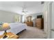 Spacious main bedroom with carpeted floors and lots of light at 8540 Se 177Th Bartram Loop, The Villages, FL 32162