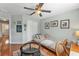 Bright bedroom featuring a daybed, wood floors and built-in shelving at 929 Magnolia Blossom Ct, Apopka, FL 32712