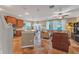 Open floor plan living room with sectional sofa and large windows at 929 Magnolia Blossom Ct, Apopka, FL 32712