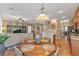 Open concept dining area with wood table and chairs, near kitchen at 929 Magnolia Blossom Ct, Apopka, FL 32712