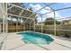 Relaxing screened-in pool and spa with backyard access at 1324 Falconcrest Blvd, Apopka, FL 32712