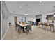 Large dining room featuring a long wooden table and modern chandelier at 1603 Lima Ave, Kissimmee, FL 34747