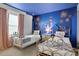 Bedroom with two twin beds, Disney mural, and fireworks at 1603 Lima Ave, Kissimmee, FL 34747