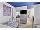 Bedroom with two twin beds, dresser, and a view of a shared living space at 1603 Lima Ave, Kissimmee, FL 34747