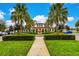 Beautiful community center with fountain and lush landscaping at 1603 Lima Ave, Kissimmee, FL 34747