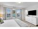 Bedroom with a large TV and dresser at 1603 Lima Ave, Kissimmee, FL 34747