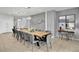Long dining table with gray chairs, perfect for large gatherings at 1603 Lima Ave, Kissimmee, FL 34747