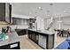 Updated kitchen boasting dark cabinetry, granite counters, and a large island at 1603 Lima Ave, Kissimmee, FL 34747