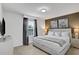 King-size bed in a spacious bedroom with ambient lighting at 1603 Lima Ave, Kissimmee, FL 34747