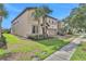 Two-story house with palm trees and brick driveway at 1603 Lima Ave, Kissimmee, FL 34747