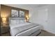King-size bed and nightstands in a tranquil bedroom at 1603 Lima Ave, Kissimmee, FL 34747