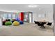 Spacious game room with a seating area and dining table at 1603 Lima Ave, Kissimmee, FL 34747