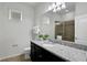 Clean bathroom with granite vanity, large mirror and shower at 1603 Lima Ave, Kissimmee, FL 34747