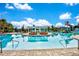 Relaxing resort-style pool with lounge chairs and umbrellas at 1603 Lima Ave, Kissimmee, FL 34747