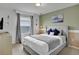 Bedroom with a queen bed, window blinds, and Moana-themed decor at 1603 Lima Ave, Kissimmee, FL 34747