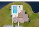Community pool and clubhouse with surrounding landscaping at 22103 Sandalwood Dr # 103, Wildwood, FL 34785