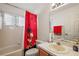 Bathroom with Minnie Mouse theme, tub, and updated vanity at 25114 Meriweather Rd, Leesburg, FL 34748