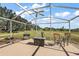 Relaxing screened patio overlooking a green space at 25114 Meriweather Rd, Leesburg, FL 34748