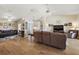 Open living room with hardwood floors and multiple seating areas at 25114 Meriweather Rd, Leesburg, FL 34748