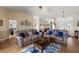 Bright living room with hardwood floors, comfortable seating, and ample natural light at 25114 Meriweather Rd, Leesburg, FL 34748