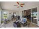 Bright sunroom with seating area and view of patio at 25114 Meriweather Rd, Leesburg, FL 34748