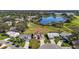 Aerial view of homes near a lake and golf course at 25114 Meriweather Rd, Leesburg, FL 34748