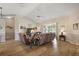 Living room with hardwood floors, recessed lighting, and comfortable seating at 25114 Meriweather Rd, Leesburg, FL 34748