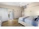 Charming bedroom with a queen-size bed and access to a patio at 25114 Meriweather Rd, Leesburg, FL 34748