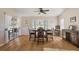 Casual dining area with hardwood floors and sliding glass doors to patio at 25114 Meriweather Rd, Leesburg, FL 34748