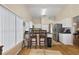 Kitchen features a breakfast bar with seating and stainless steel appliances at 25114 Meriweather Rd, Leesburg, FL 34748