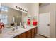 Double vanity bathroom with a shower and lots of counter space at 25114 Meriweather Rd, Leesburg, FL 34748