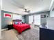 Cozy bedroom with red bedding, great for or guests at 33413 Fairway Rd, Leesburg, FL 34788