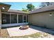 Backyard patio with fire pit and screened enclosure at 33413 Fairway Rd, Leesburg, FL 34788