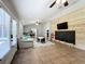 Bright playroom with a chalkboard wall, built-in play area, and access to backyard at 33413 Fairway Rd, Leesburg, FL 34788