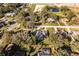 An aerial view of a house nestled in a quiet residential neighborhood at 33516 Overton Dr, Leesburg, FL 34788